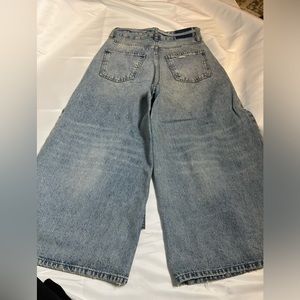 Slightly distressed jeans, worn once . Mint condition